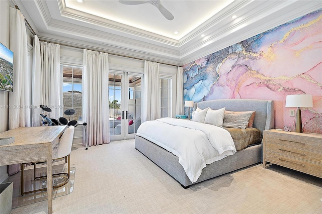 bedroom featuring a raised ceiling, access to exterior, ceiling fan, and ornamental molding