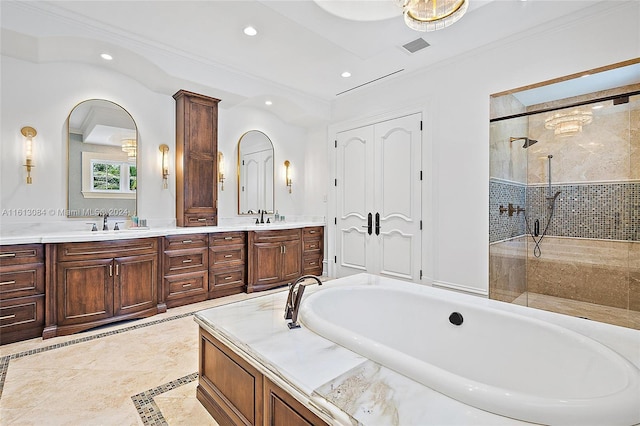 bathroom with vanity, ornamental molding, and walk in shower