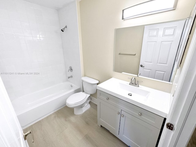 full bathroom with shower / bathing tub combination, vanity, toilet, and wood-type flooring