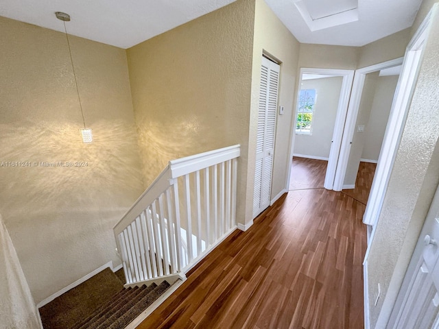 corridor featuring dark hardwood / wood-style floors