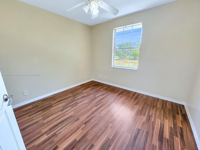 empty room with ceiling fan and wood-type flooring