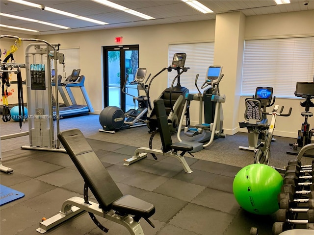 exercise room featuring a paneled ceiling