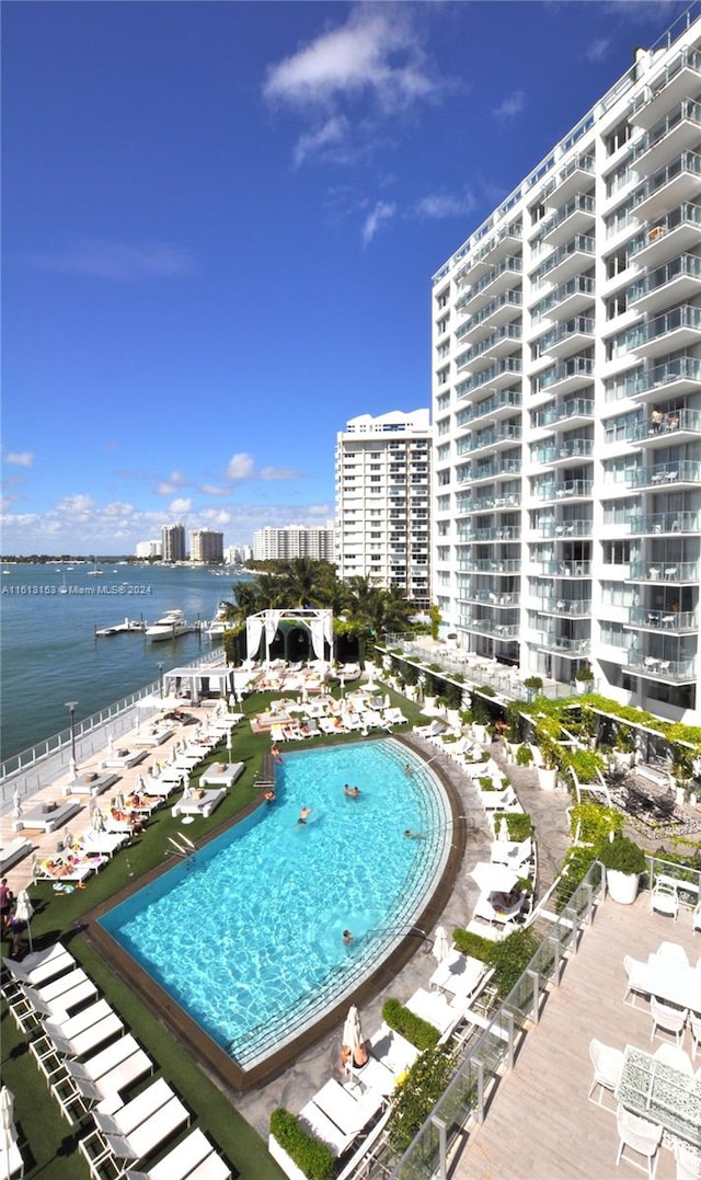 view of pool featuring a water view