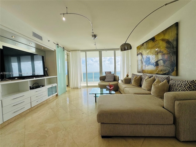 living room with visible vents and expansive windows