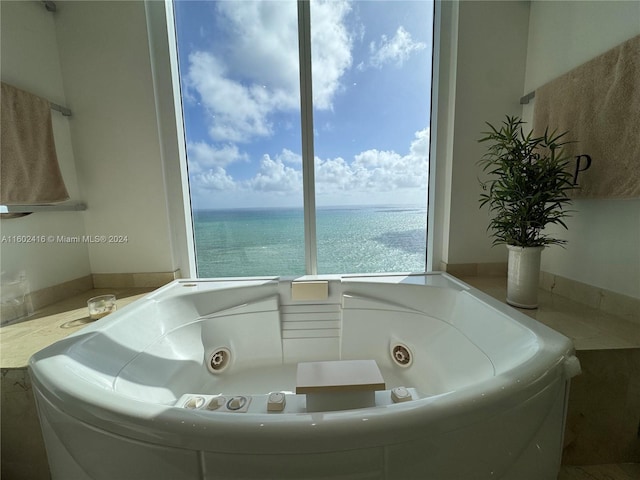 bathroom featuring a tub with jets