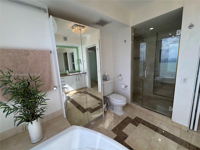 bathroom featuring toilet, visible vents, a shower stall, and vanity