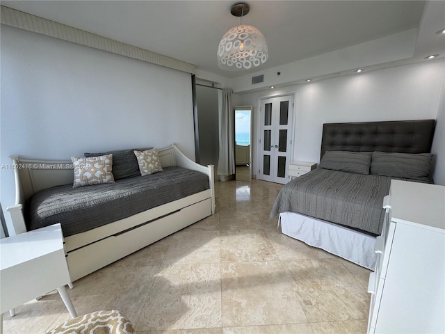bedroom with visible vents and french doors