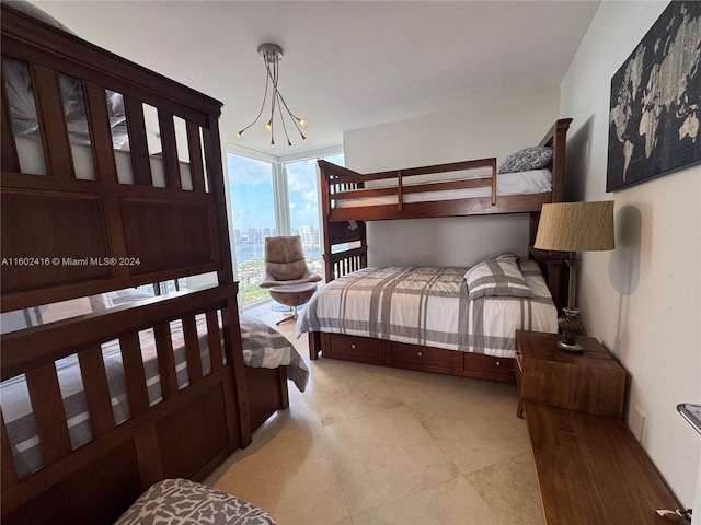bedroom featuring an inviting chandelier and floor to ceiling windows