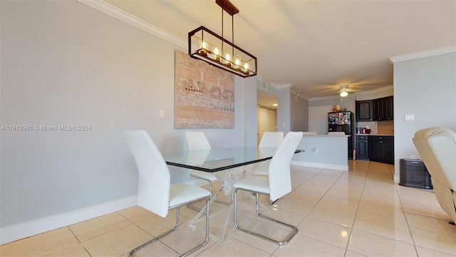 tiled dining space with ceiling fan with notable chandelier and crown molding