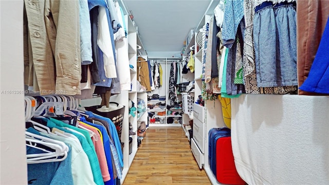 spacious closet featuring light hardwood / wood-style floors