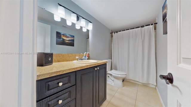 bathroom with a shower with shower curtain, vanity, toilet, and tile patterned floors