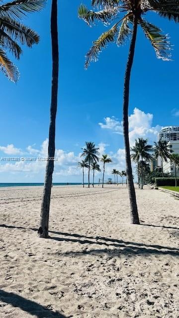 property view of water featuring a beach view