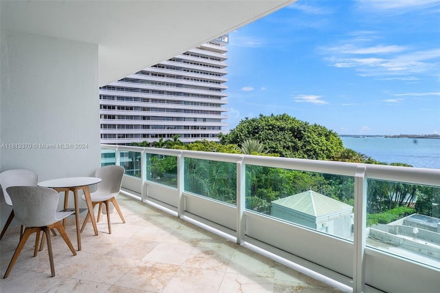 balcony featuring a water view