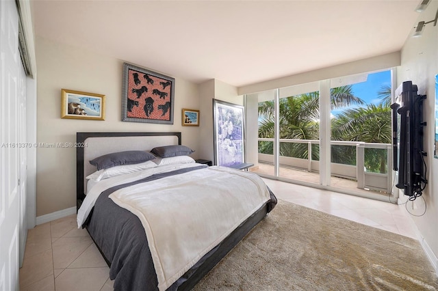 tiled bedroom featuring access to exterior