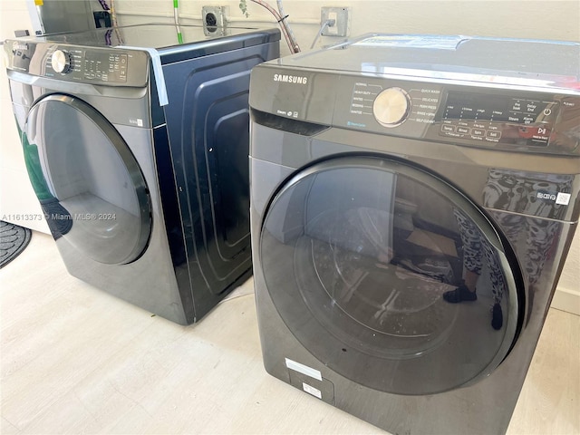 washroom featuring independent washer and dryer