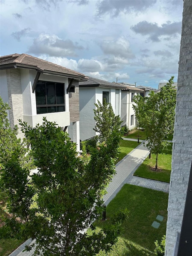 view of side of property with a yard