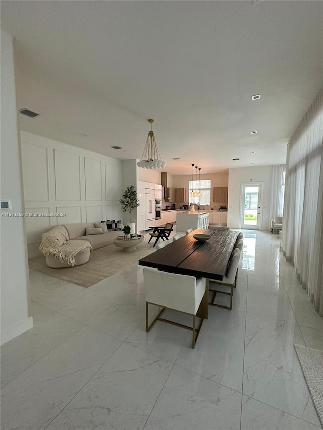 unfurnished dining area with light tile flooring