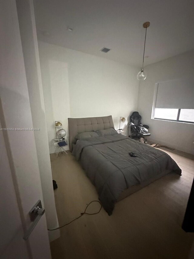 bedroom featuring hardwood / wood-style floors