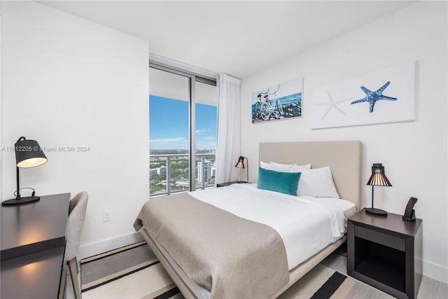 bedroom featuring a wall of windows