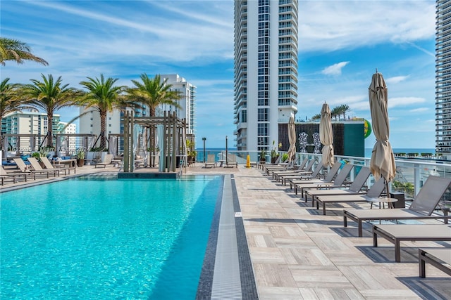 view of swimming pool featuring a patio area