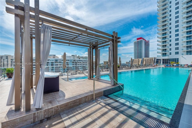 view of swimming pool featuring a pergola