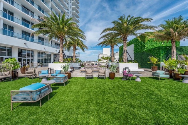 view of yard with a patio and a balcony