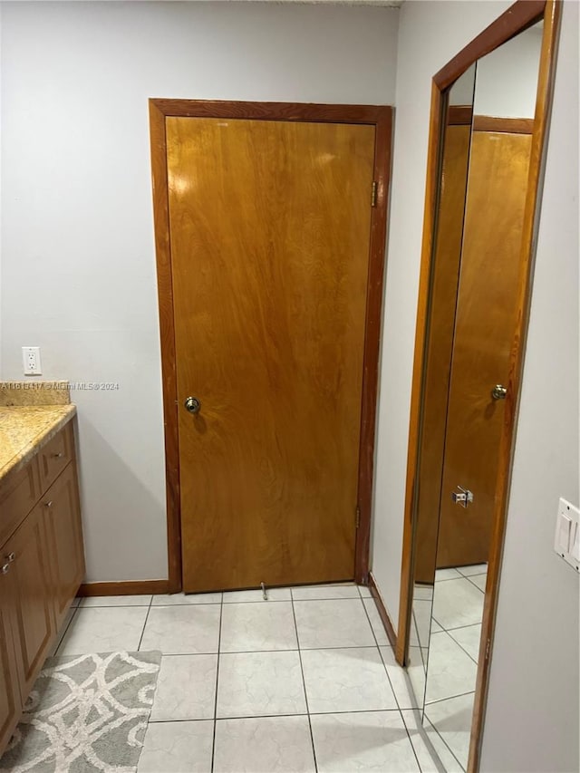 bathroom with vanity and tile patterned flooring