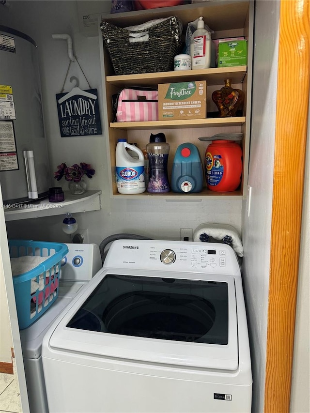 laundry room with washer / dryer and tile patterned flooring