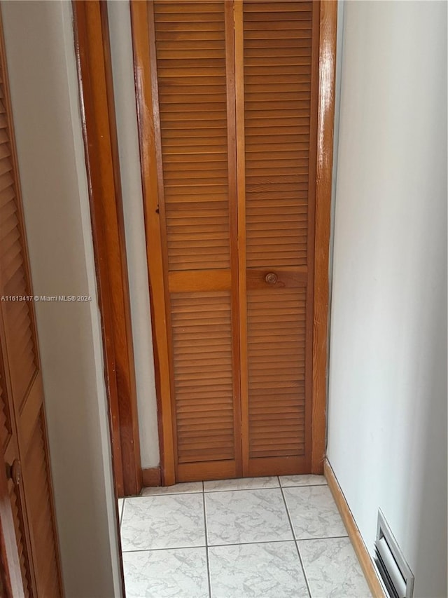 hallway with light tile patterned floors