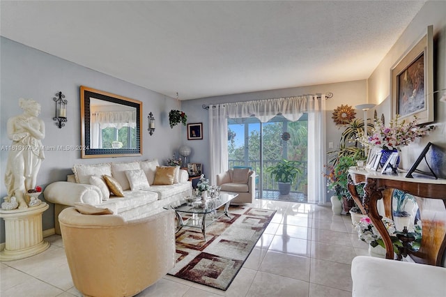 living area featuring a textured ceiling and light tile patterned flooring