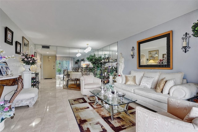 living area with light tile patterned flooring and visible vents