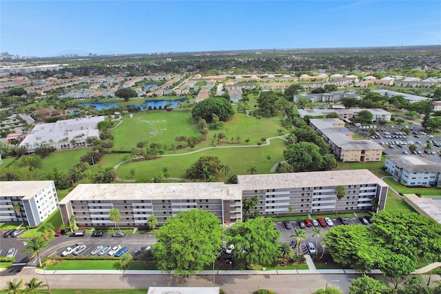 birds eye view of property with a view of city and a water view