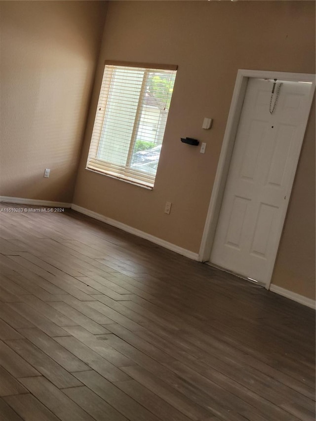 tiled spare room with ceiling fan with notable chandelier