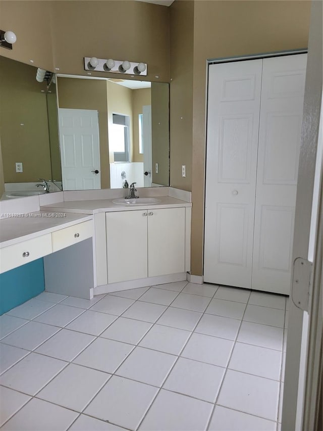 bathroom featuring tile patterned flooring and dual vanity