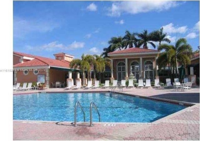 view of swimming pool featuring a patio area