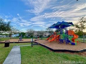 view of playground featuring a lawn