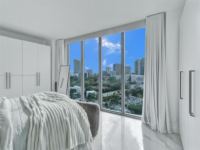 bedroom featuring floor to ceiling windows