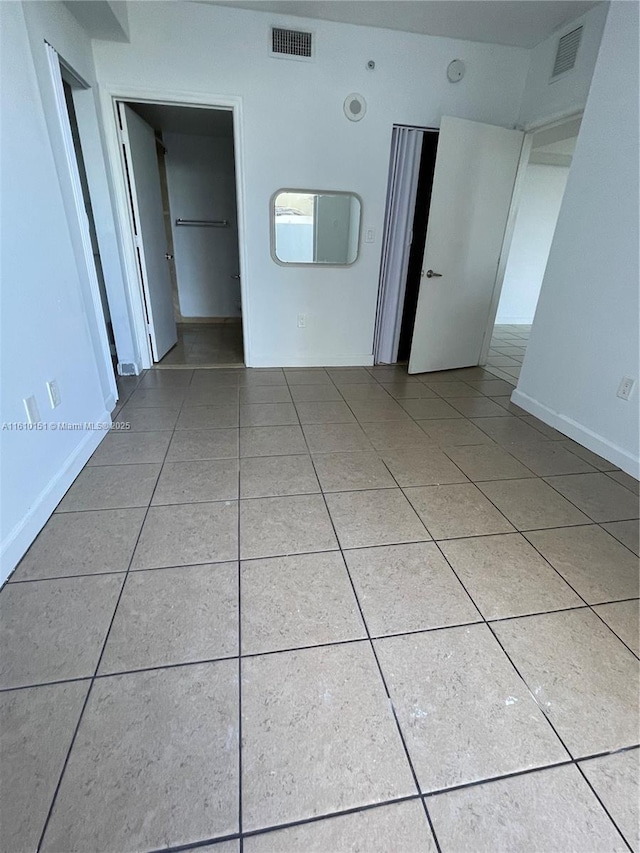 empty room with tile patterned floors