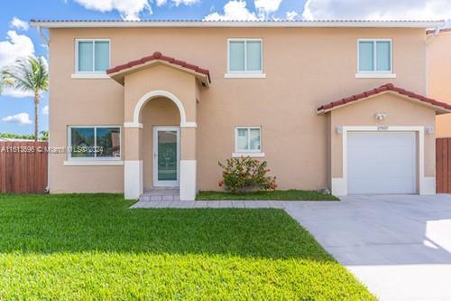 mediterranean / spanish-style house featuring a front yard