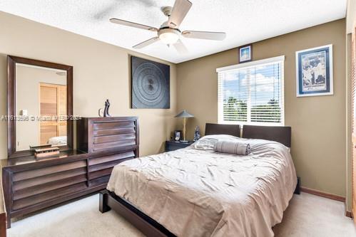 bedroom with carpet and ceiling fan