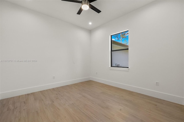 unfurnished room featuring ceiling fan and light wood-type flooring