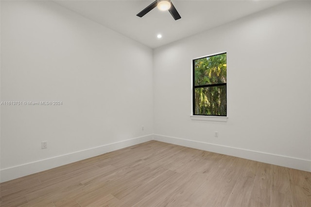 unfurnished room with ceiling fan and light hardwood / wood-style flooring