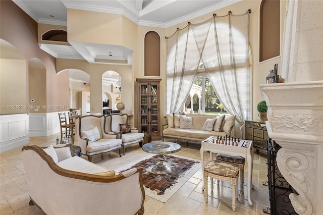 tiled living room with a towering ceiling, ornamental molding, and coffered ceiling