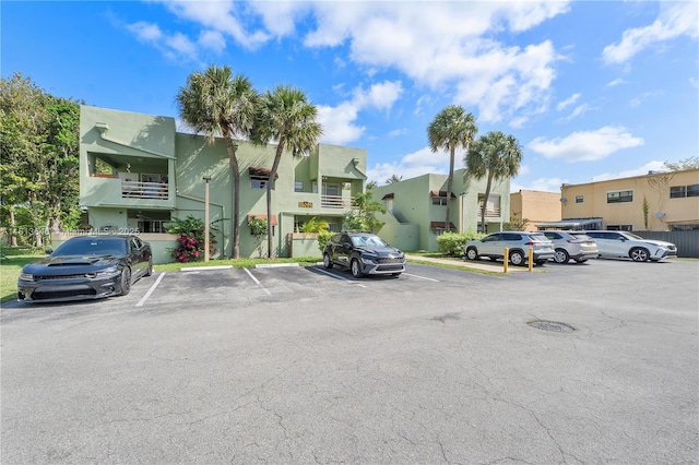 11091 NW 7th St Unit 202, Miami, FL 33172 - uncovered parking lot featuring a residential view