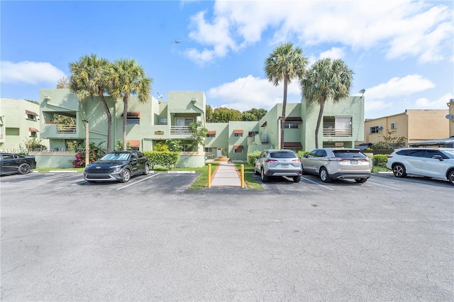 11091 NW 7th St Unit 202, Miami, FL 33172 - uncovered parking lot featuring a residential view