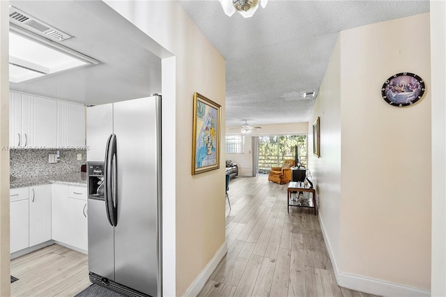 11091 NW 7th St Unit 202, Miami, FL 33172 - interior space with a textured ceiling, baseboards, visible vents, and light wood-style floors