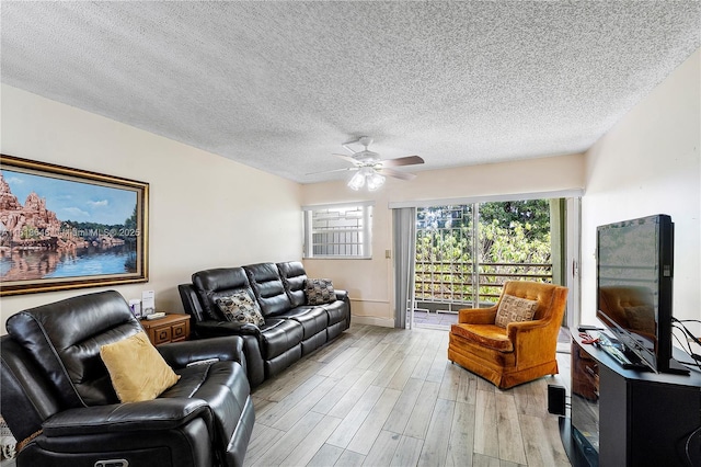 11091 NW 7th St Unit 202, Miami, FL 33172 - living room featuring light wood-type flooring, a ceiling fan, and a textured ceiling