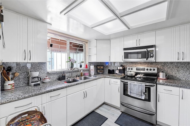 11091 NW 7th St Unit 202, Miami, FL 33172 - kitchen with a sink, white cabinets, and appliances with stainless steel finishes