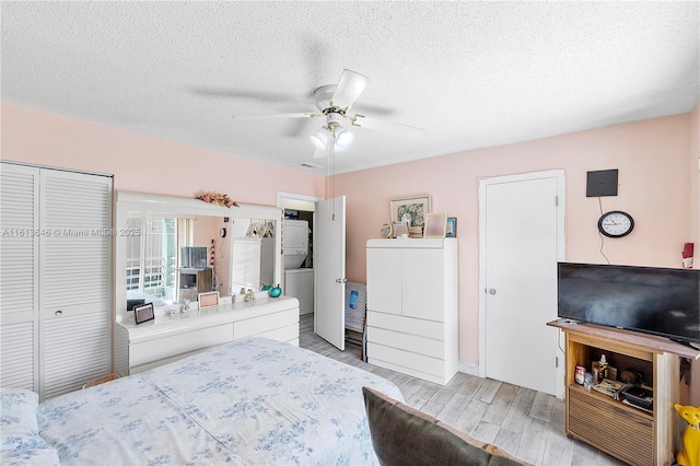 11091 NW 7th St Unit 202, Miami, FL 33172 - bedroom with a closet, light wood-type flooring, a textured ceiling, and ceiling fan