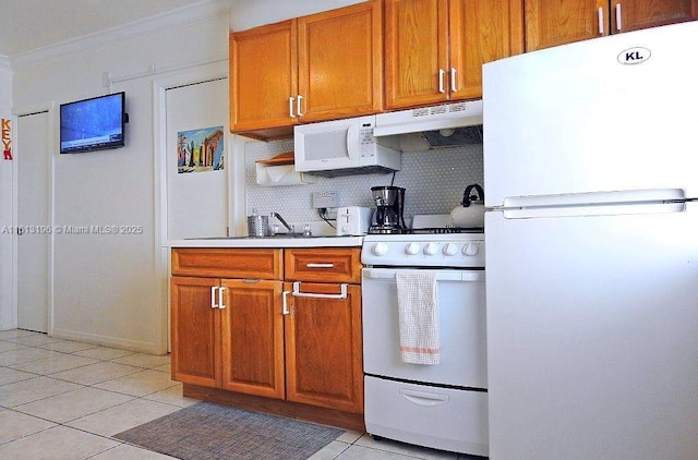 kitchen featuring light tile patterned flooring, sink, backsplash, ornamental molding, and white appliances